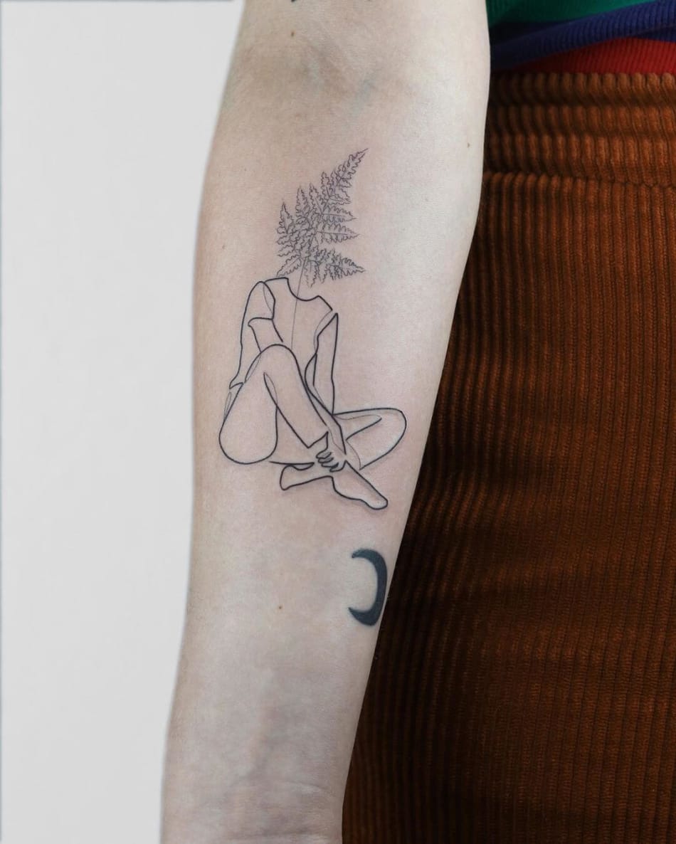 Singleline tattoo of a body with a leaf by Dominika Gajewska