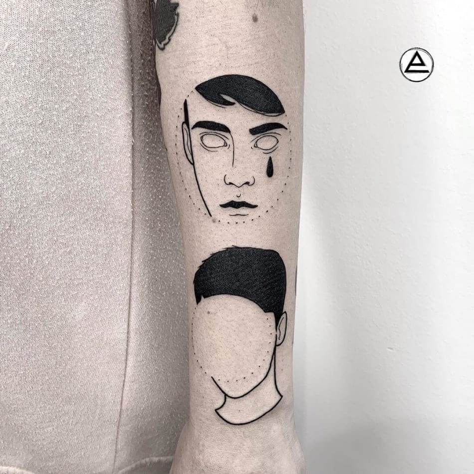 Boy without face crying tattoo by Eni Magi