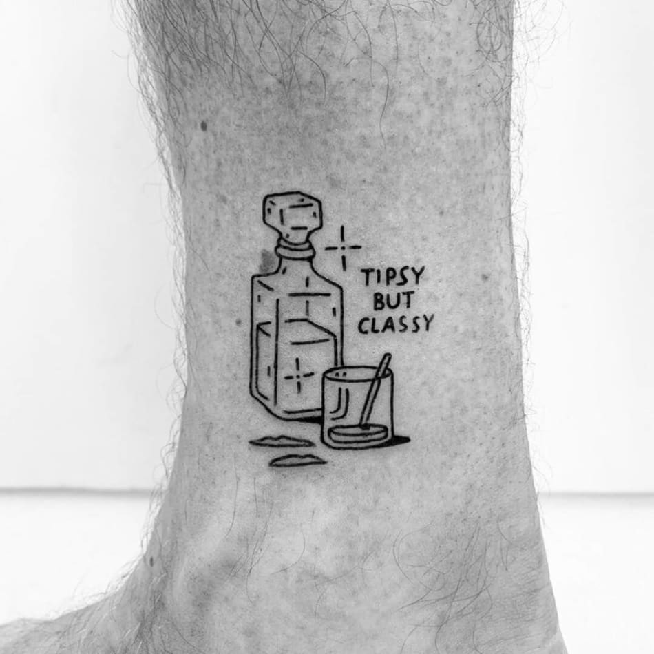 Stil life tattoo of drink with the text 'Tipsy byt classy' by Escozcc