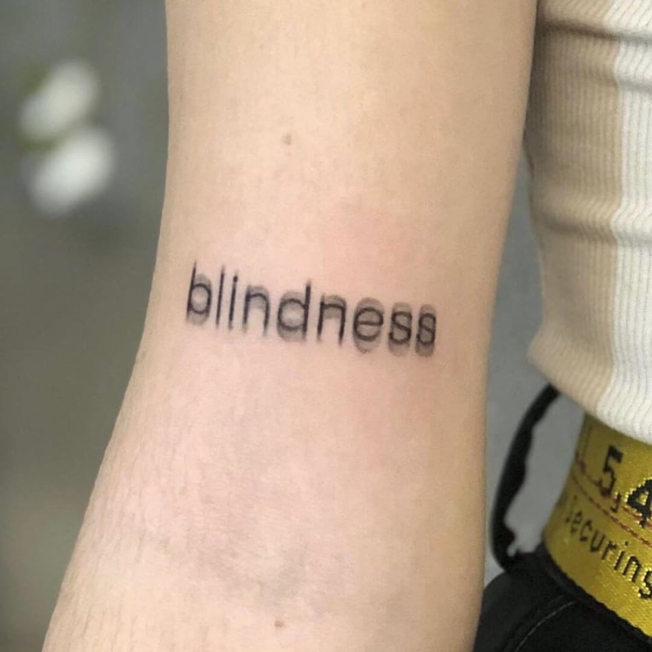 Blurred word blindness tattoo by Ivan Casabo