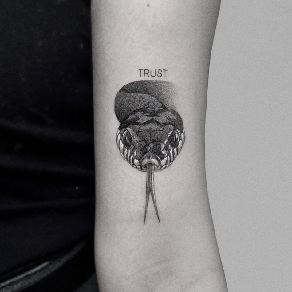snake trust tattoo by Jaime Rogles