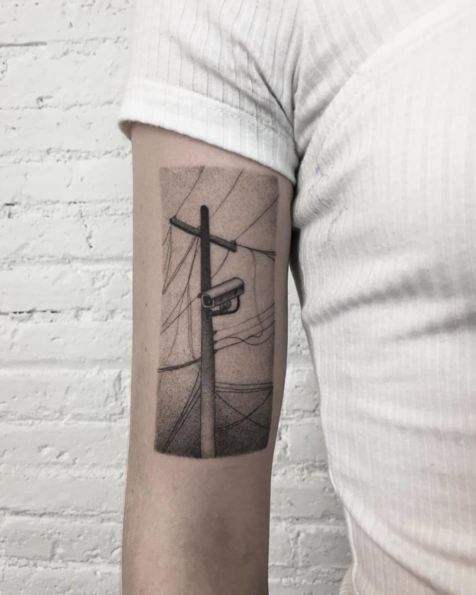 electric pole with camera dotwork tattoo by Jerome Wojny