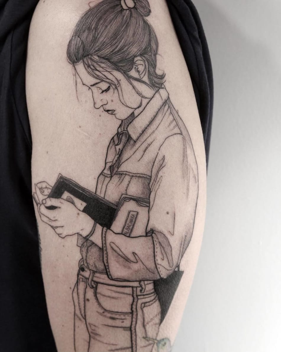 Woman reading a book tattoo by La Malafede