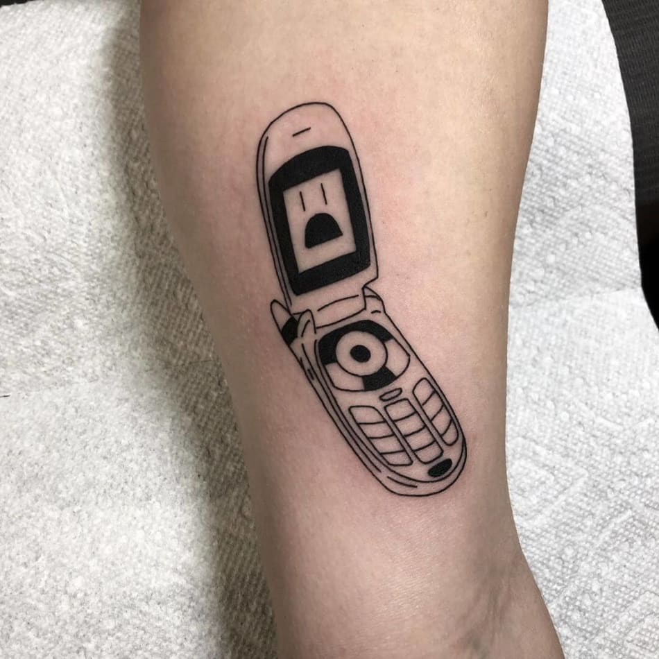 Retro foldable cellphone tattoo by laracailletattoo