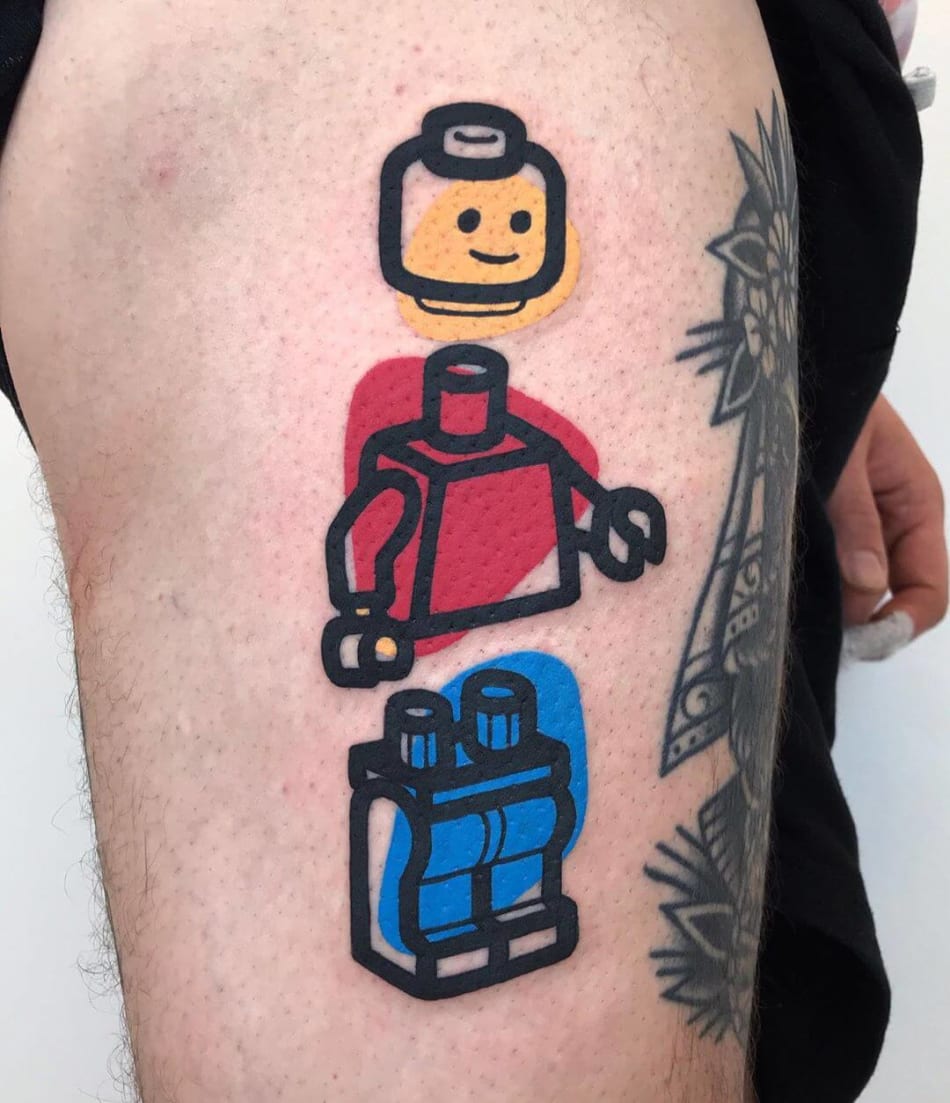 Lego figure with colored background tattoo