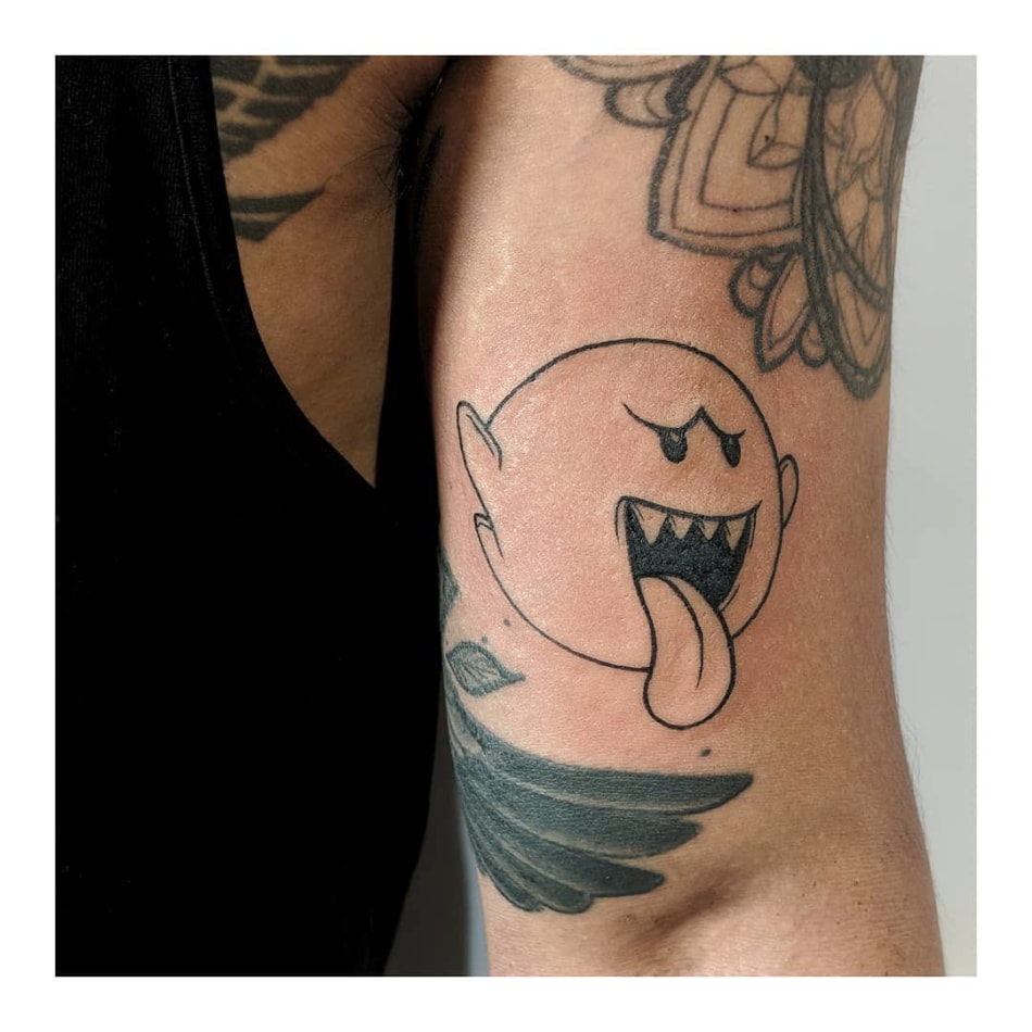 Minimal tattoo of boo from mario