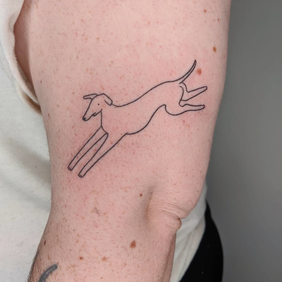 Cute minimal handpoked dog tattoo by Mellowpokes