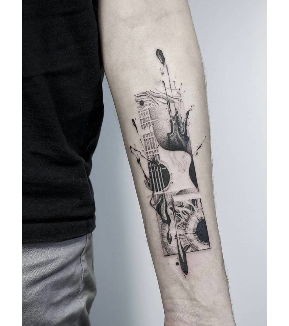 Tattoo of a guitar and an eye, tattoo with strong emotion