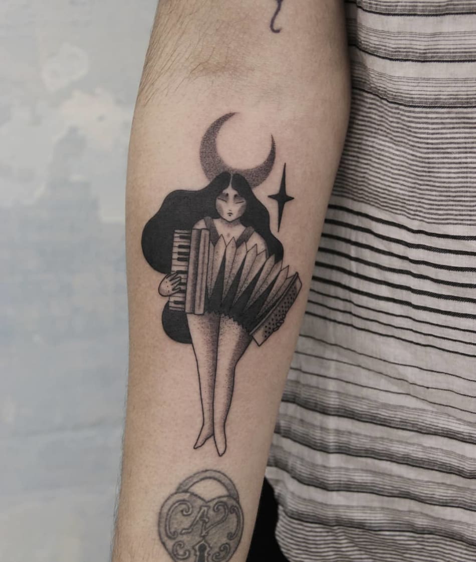 Tattoo of a woman playing the accordion