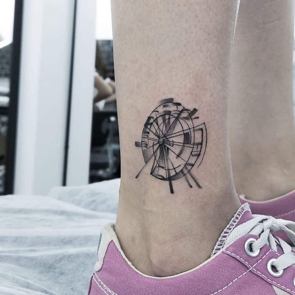 Spinning ferriswheel kermis tattoo by Osman Ergin
