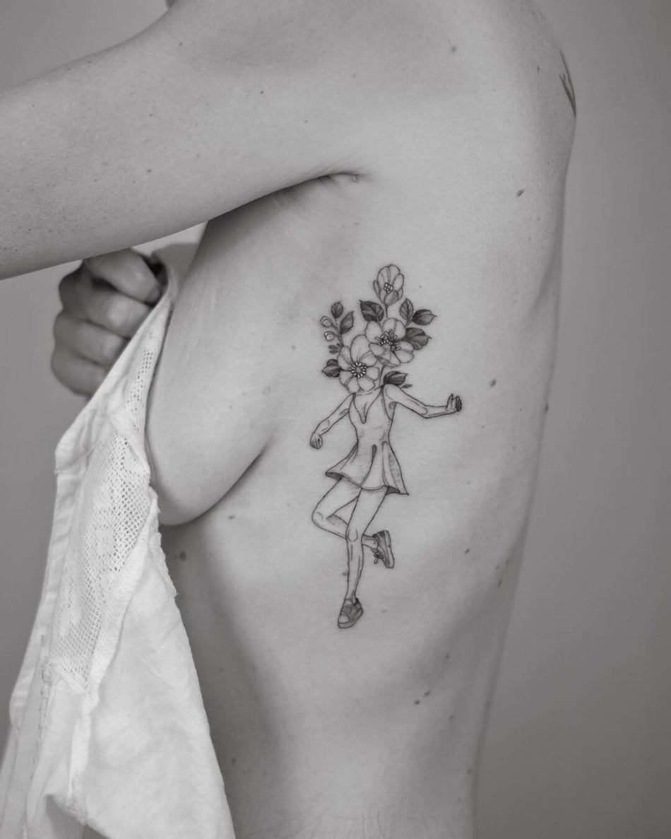 Girl with flower head tattoo by Phoebe Hunter