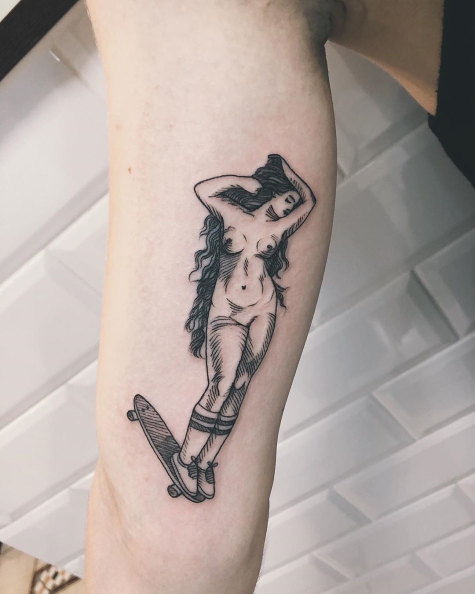 Hot woman on a skateboard tattoo