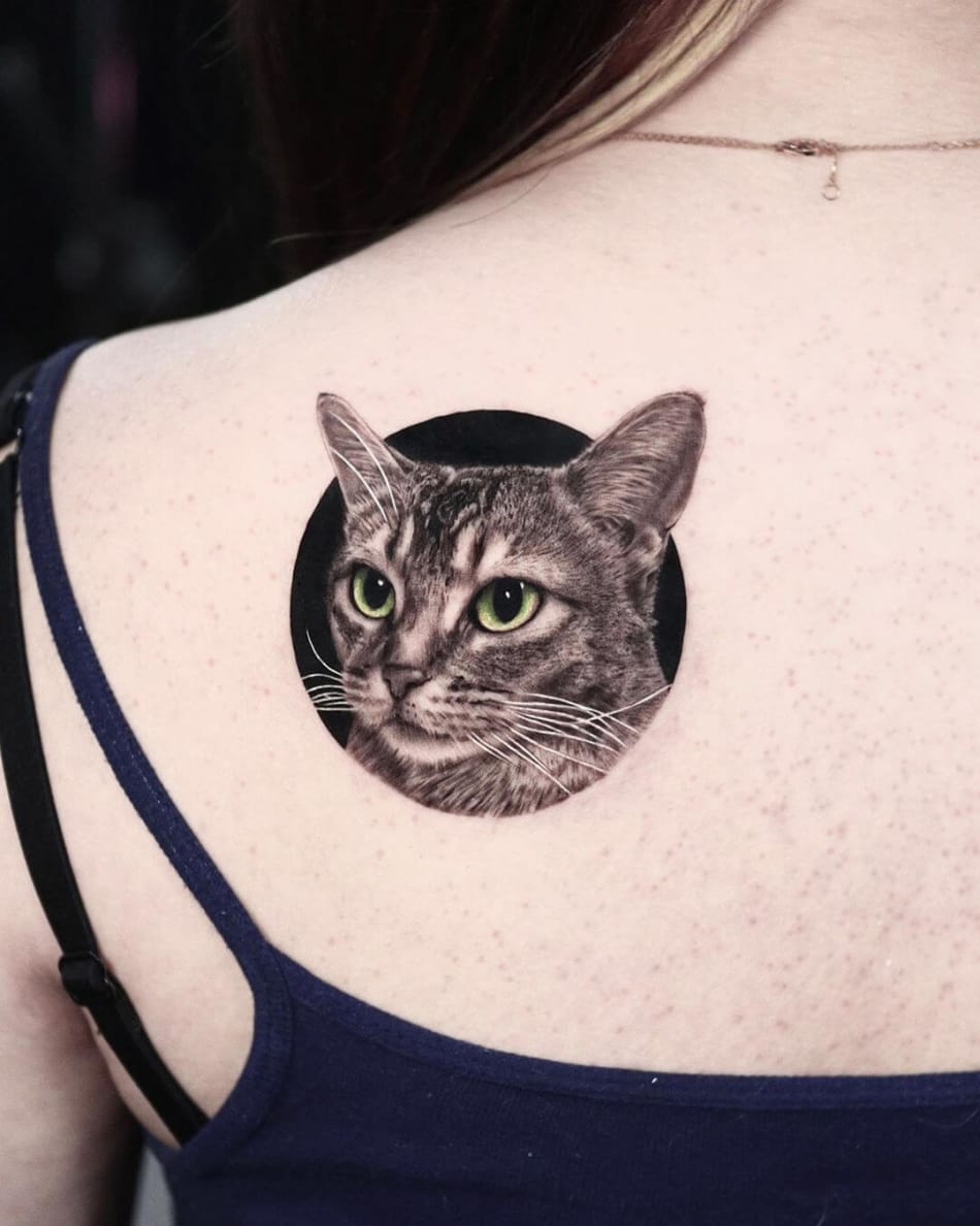 Realistic cat tattoo with green eyes by Yeono