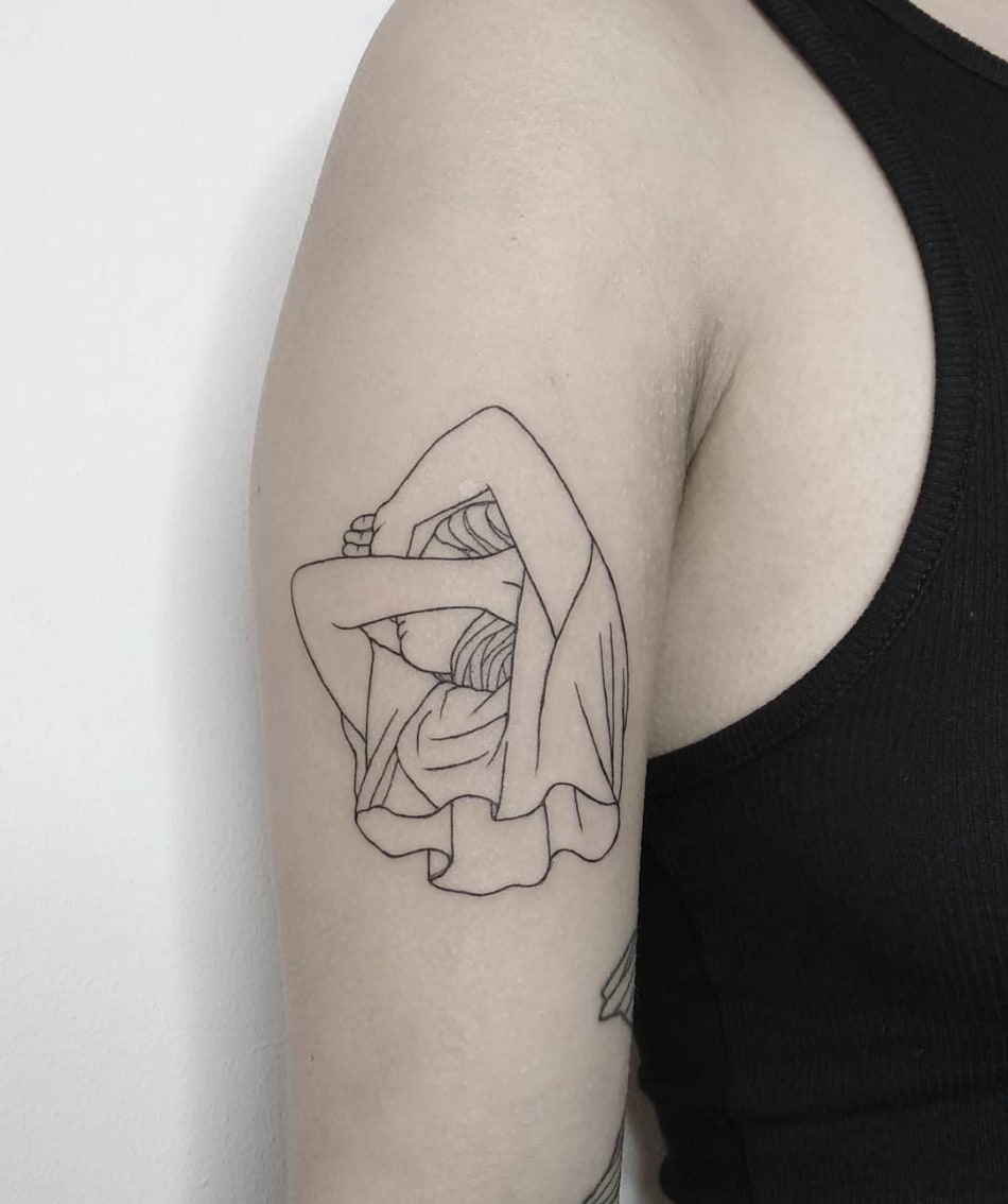 Stretching girl tattoo by Tattson