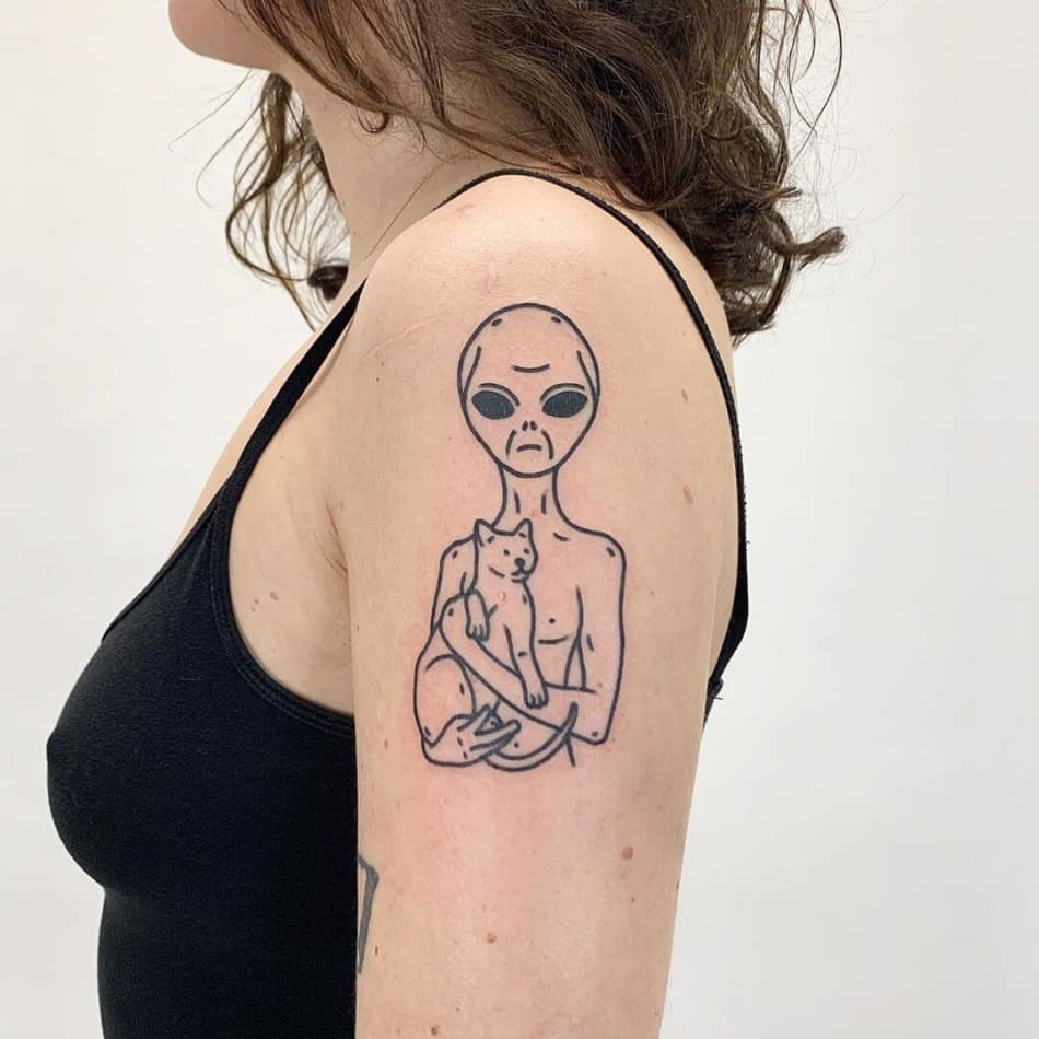 Bold outlined tattoo of an alien holding a cat by The Magic Rosa