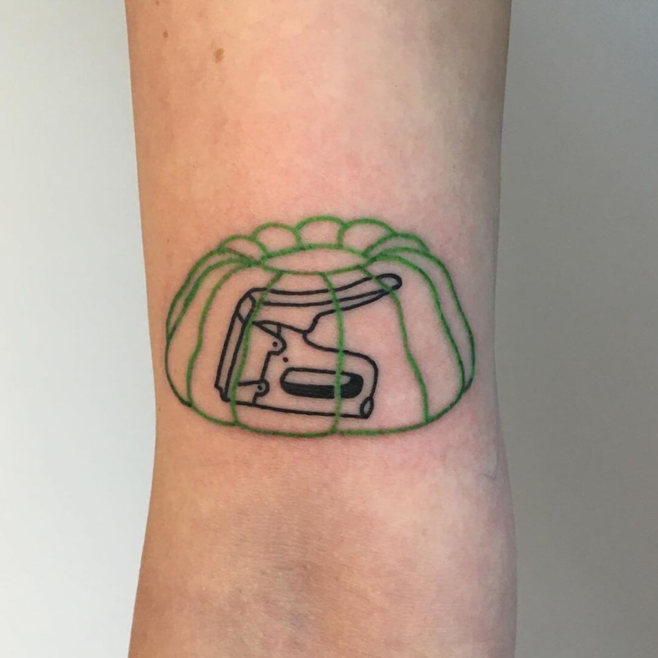 Stapler in pudding tattoo by Violette Violence