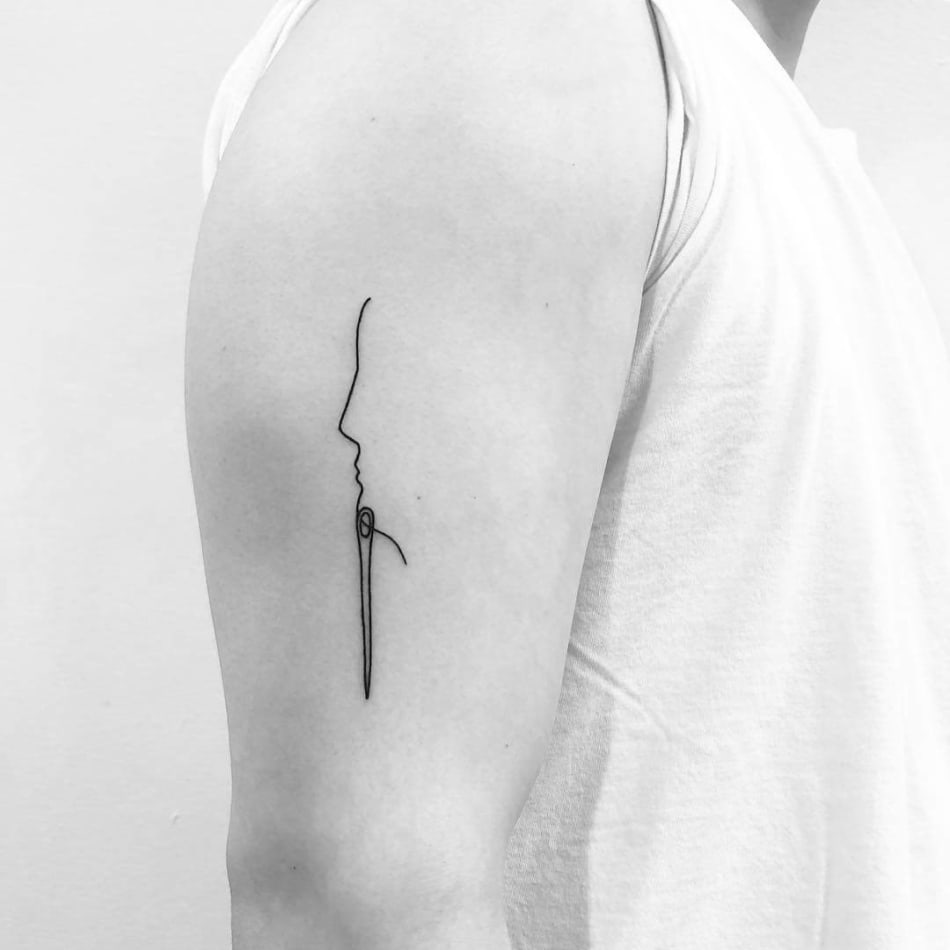 Yi Stropky Needle Face Thread tattoo