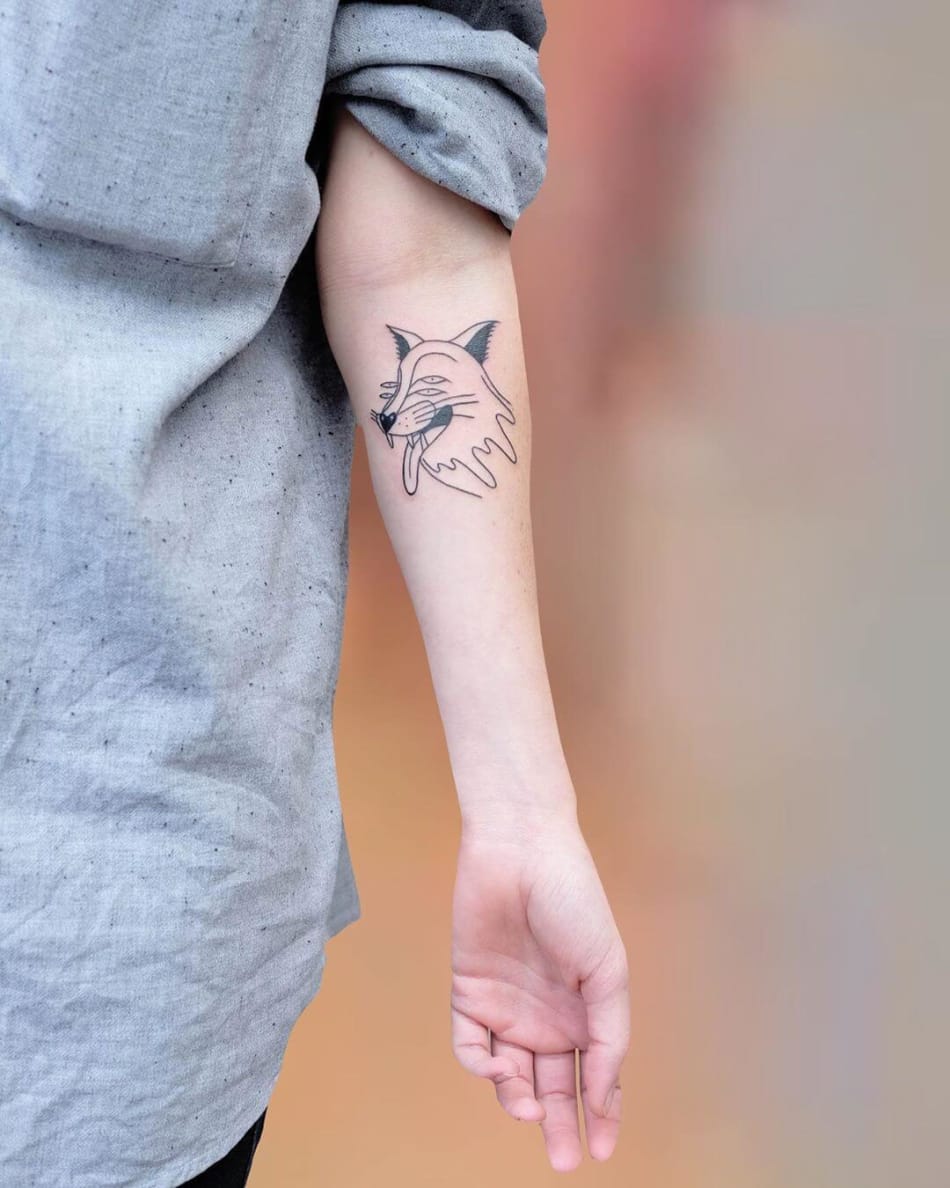 Tattoo of cartoon fox