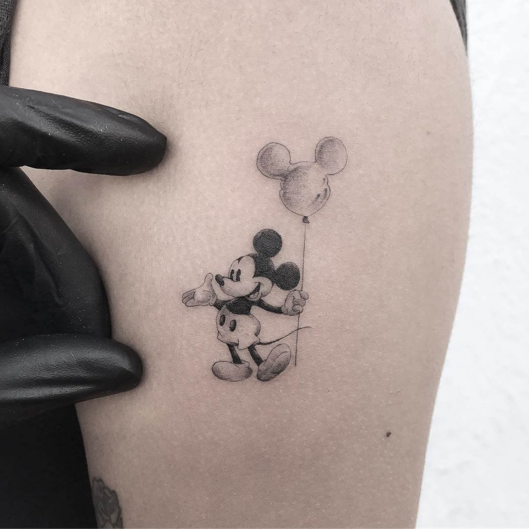 Mickey mouse with a balloon tattoo