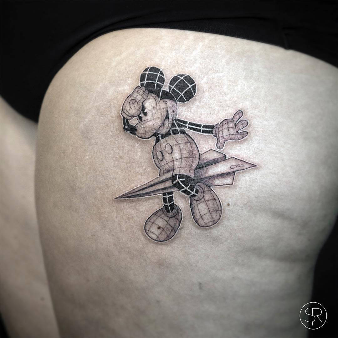 Mickey mouse on a paper plane tattoo