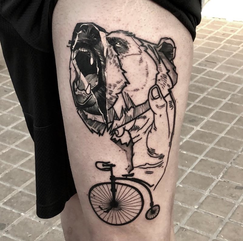 Bear with bicycle tattoo