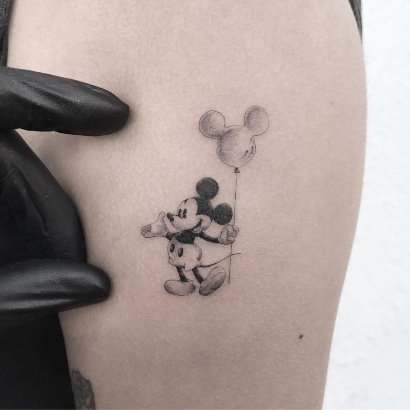 Mickey mouse with a balloon tattoo