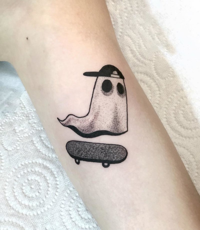 Little ghost on a skateboard tattoo