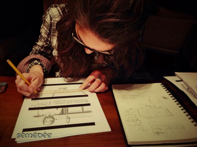 Élodie designing the storyboard