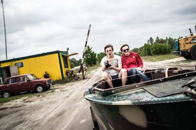 Yulia and Vanya riding the boat on the way back to Slavutych