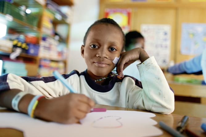 Aboubacar* in a classroom at La Maison de Massongex