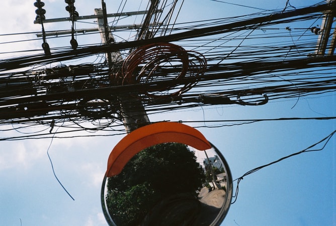 mirror, cables and blue sky