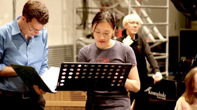 Samuel Andreyev rehearsing with soprano Peyee Chen