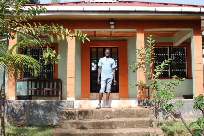 My father in front of his house