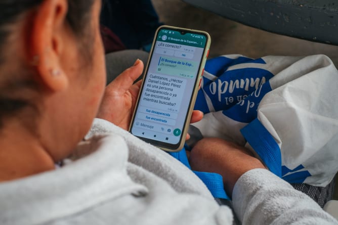 A member of a search collective performs user-testing with the Bosque’s Whatsapp chatbot.