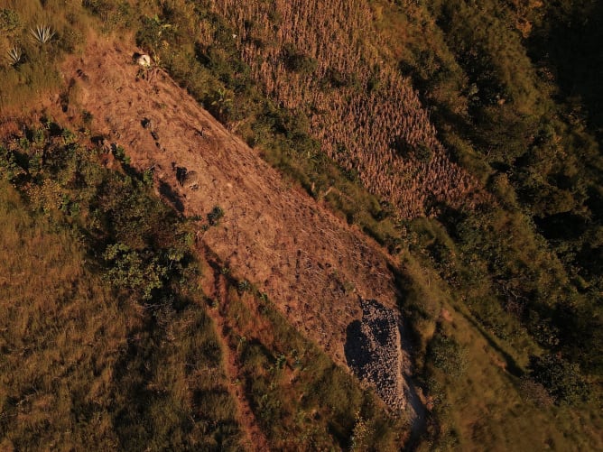 The terrain is very steep, and there are many loose rocks (including large boulders) that can shift during heavy rains, especially without year-round vegetation.