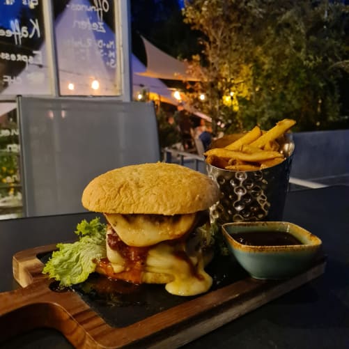 Enjoy a burger on the cozy terrace