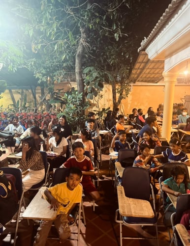 The school courtyard serves as a classroom, accommodating around a hundred students each evening.