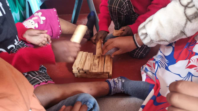 A local carpenter made building blocks for the children.