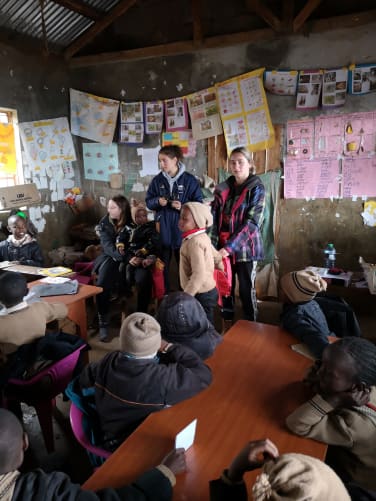 Some volunteers in a third-grade classroom