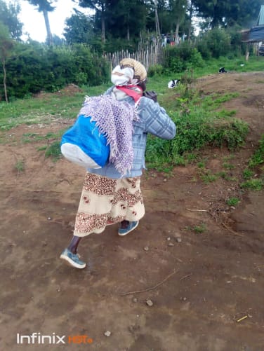 A grandmother brings food to the school
