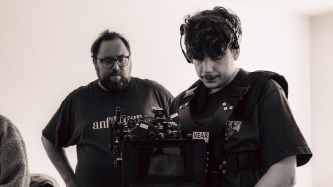 The director and DP reviewing a shot during filming.
