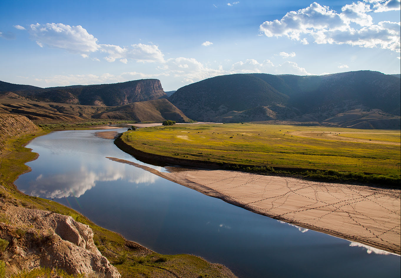 WRC's acquisition of Cross Mountain Canyon Ranch encompasses 2.5 miles of riverbank along both sides of the Yampa River. Cross Mountain Canyon is visible in the background.