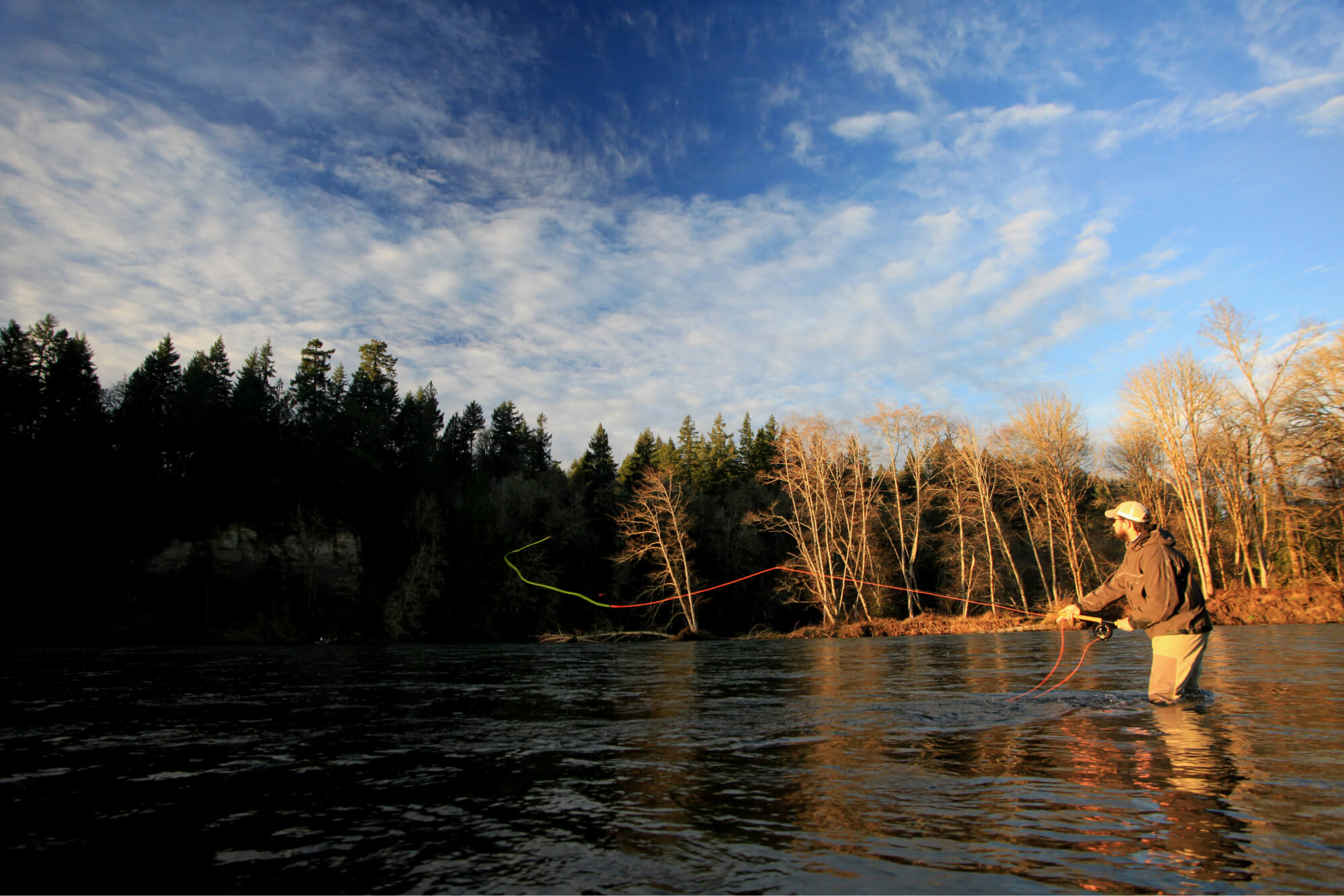 A man fishing in Cowlitz River