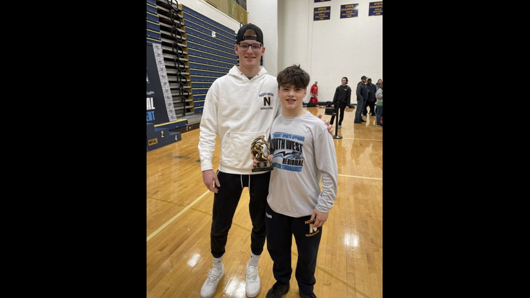 Former Outstanding Wrestler Chase Kranitz of Norwin presented this year's OW trophy to Landon Sidun who wrestles for Norwin Middle School.