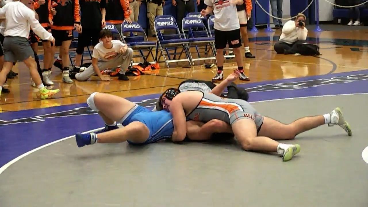 Greater Latrobe's Corey Boerio pins Hempfield Area's Eli Binakonsky in overtime at 215 pounds.