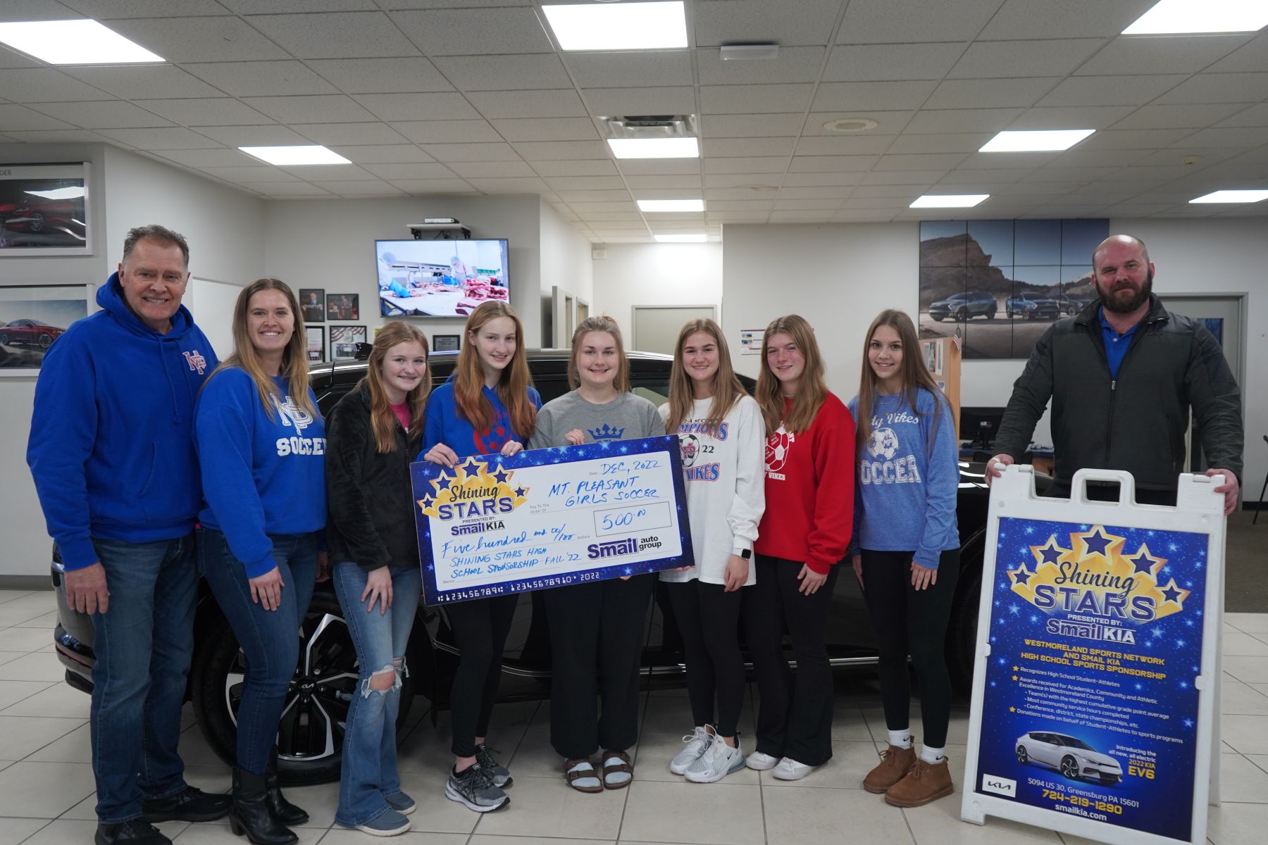 From L-R: Coach Rich Garland, Coach Jessica Garland, Regan McCormick, Caitlyn Fullman, Cassidy Fullman, Brooklyn Ulery, Rylin Bugosh, Maggie Piper, Dylan Hewitt (Smail Kia Sales Manager)