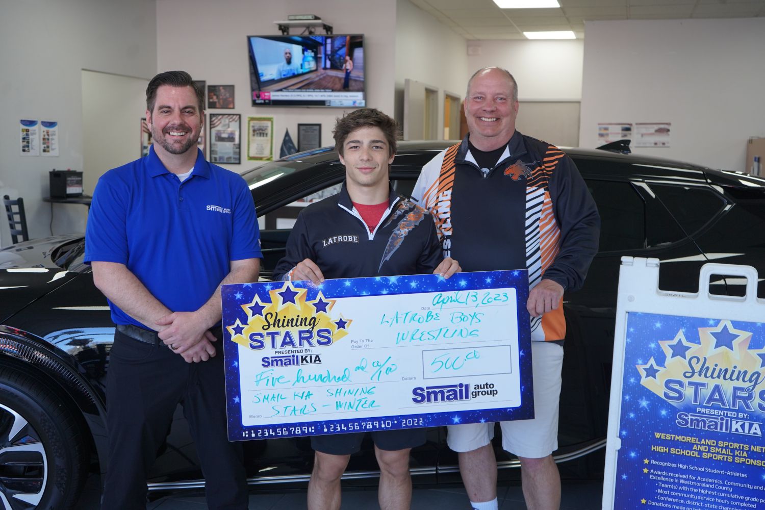 From L-R: Jeff Mikell (Smail Kia), Vinny Kilkeary, Coach Mark Mears.