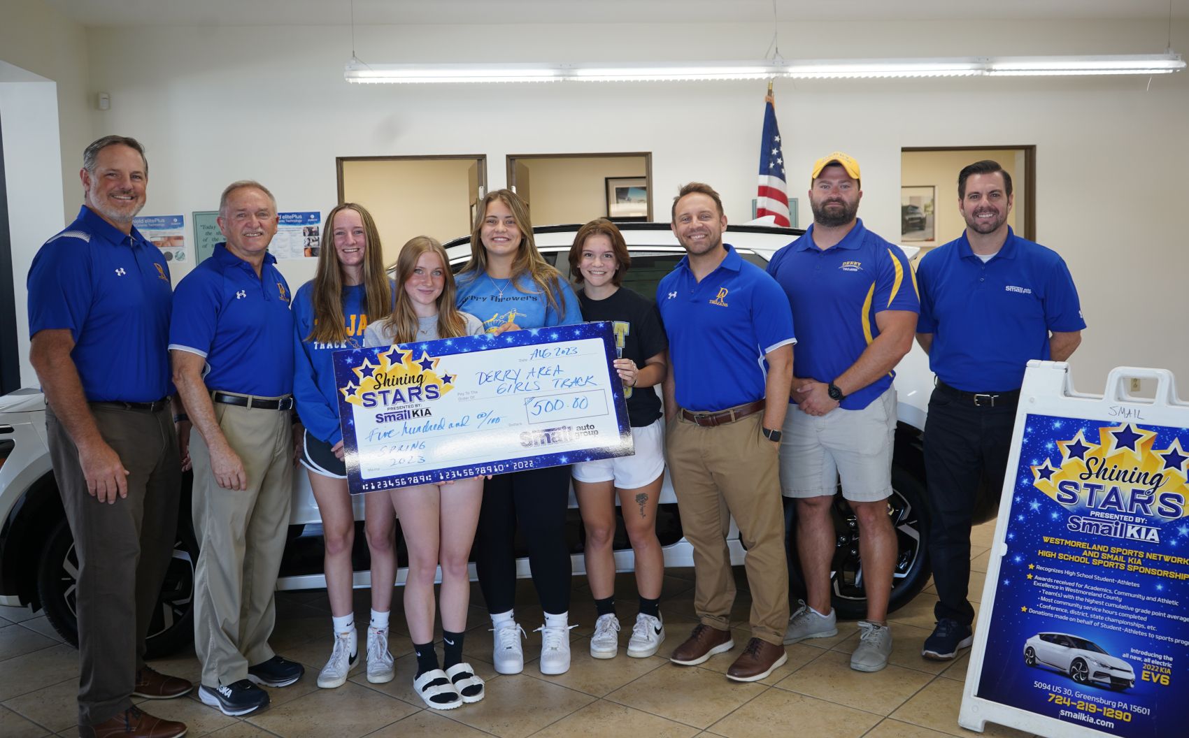 Pictured From L-R: Coach Dave McNichol, Coach Gene Brisbane, Jane Huss, Tessa Hayes, Sophia Mazzoni, Reigna Taylor, Coach Mark Curcio, Coach Greg Rager, Jeff Mikell (Smail Kia)