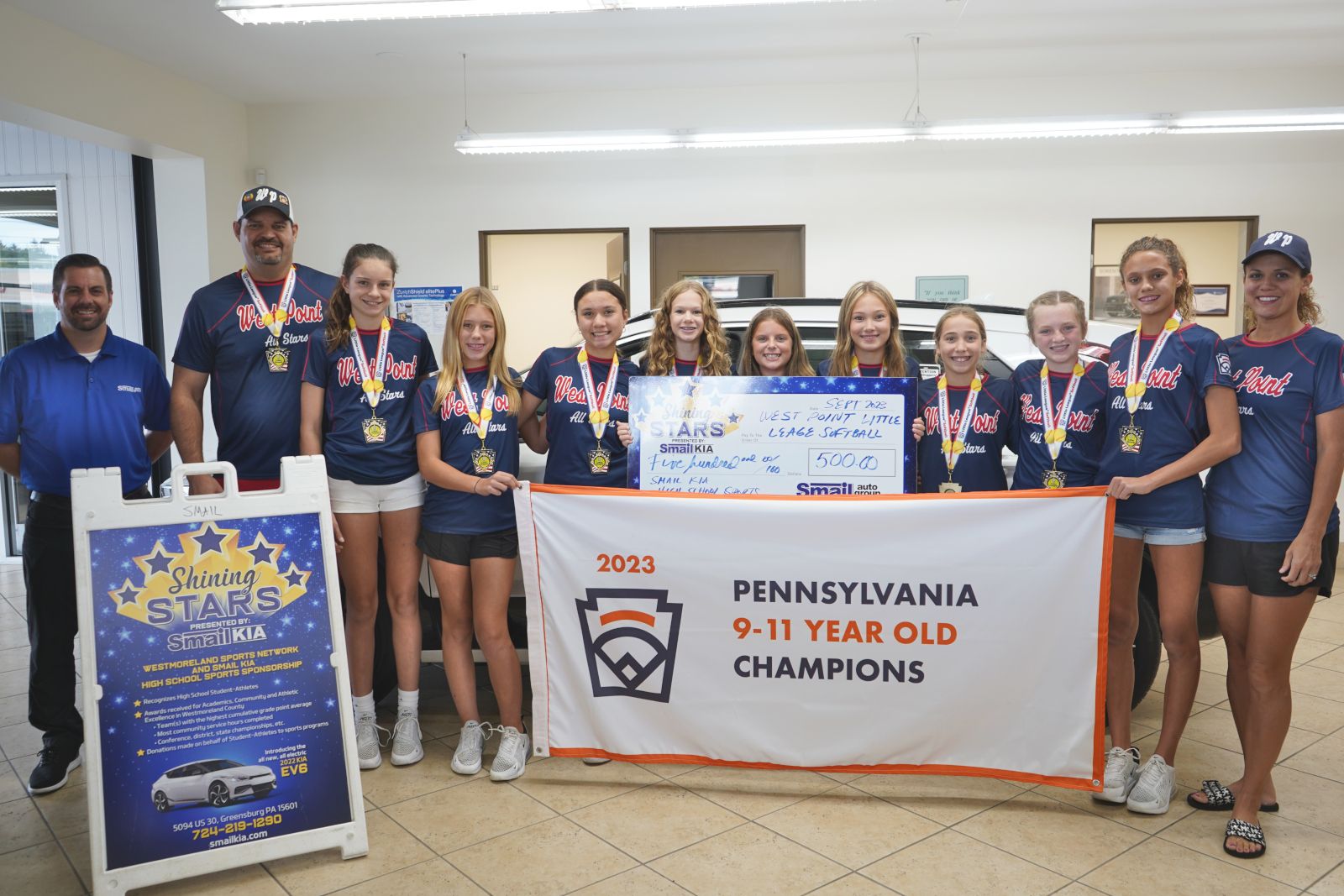 Pictured From L-R: Jeff Mikell (Smail Kia), Coach Matt Maiers, Morgan Maiers, Jocelyn Luft, Peyton Reamer, Caitlyn Leach, Lily Carroll, Camryn Ecker, Piper Hoppel, Braylyn Graft, Jayelyn Luft, Coach Tina Madison.