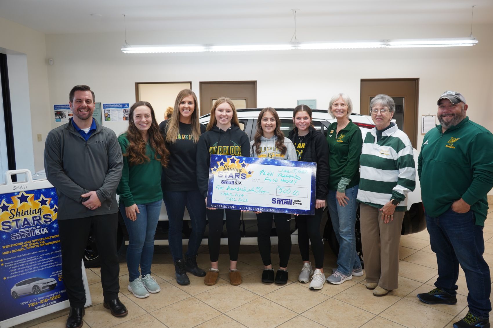 Pictured From L-R: Jeff Mikell (Smail Kia), Sarah McCallion, Coach Karlee Rubright, Liz Welsh, Ava Hershberger, Rilie Moors, Coach Cindy Dutt, Coach Myrt Driscoll, Coach Chad Hershberger